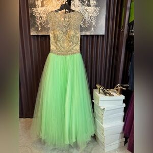 Extravagantly Heavily Beaded,  cropped sleeve, ball gown with keyhole back.